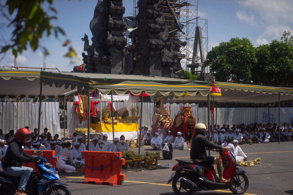 People gather in the streets on Sunday for prayer before the roosters were busted out