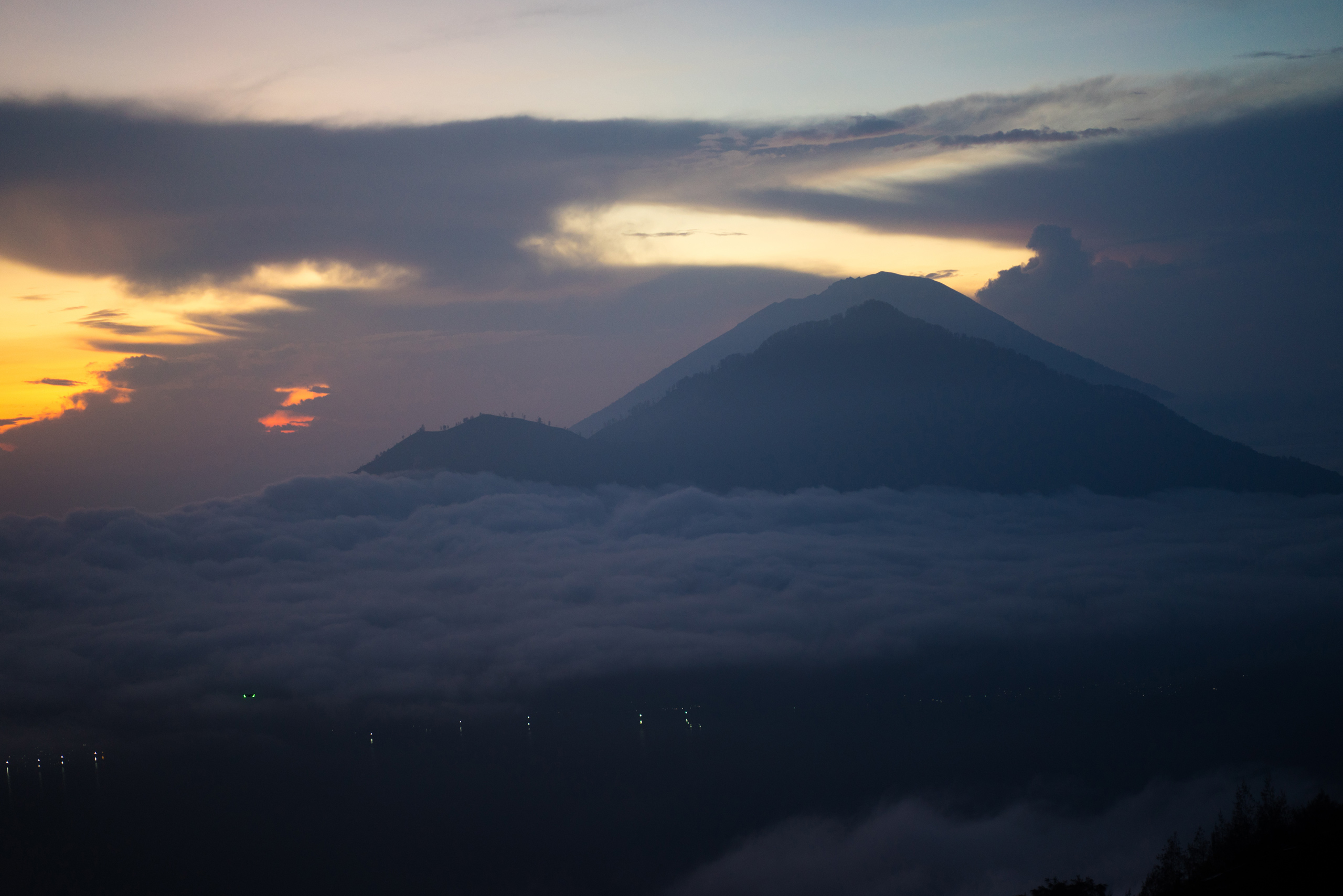 Sunrise viewed from atop Batur, with Abang and Agung seen in the foreground