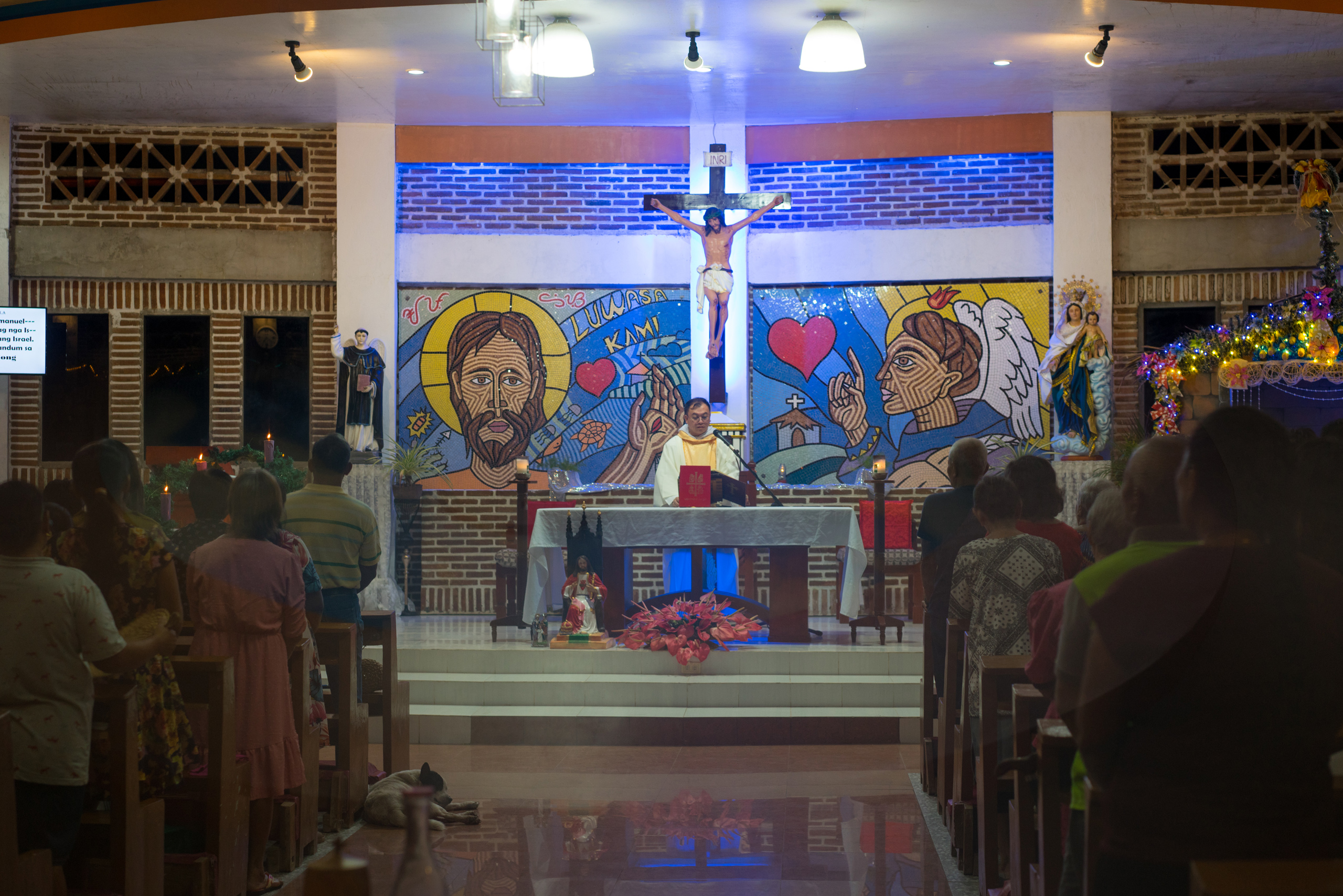 Father Charlie captivates the locals and their families, but not the dog