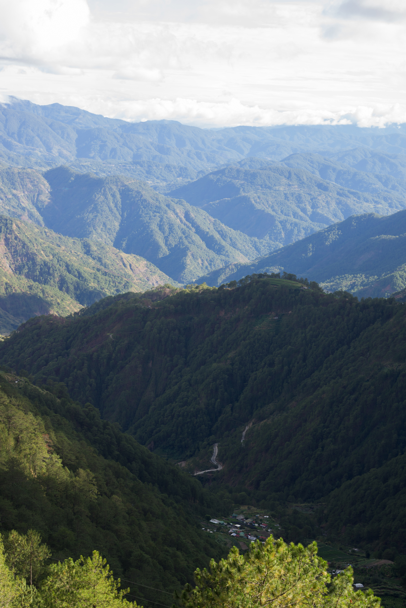 A road and a little barangay can be seen from the "highest point"