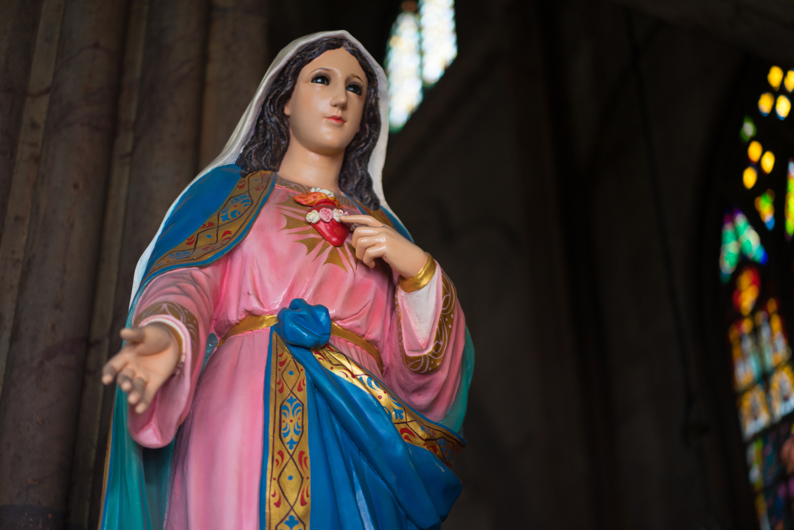 Statue of the Virgin Marry touching her Sacred Heart in the Metal Cathedral