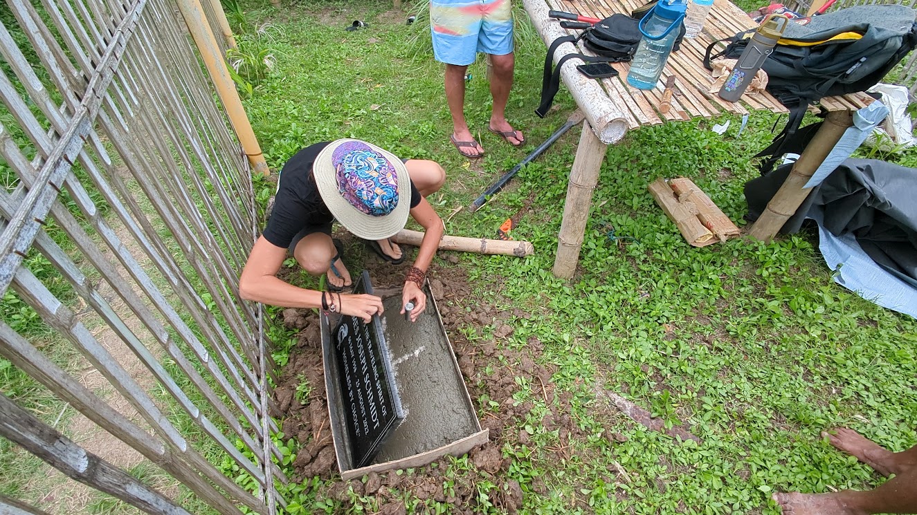 Putting some of Jim's ashes under his lapida